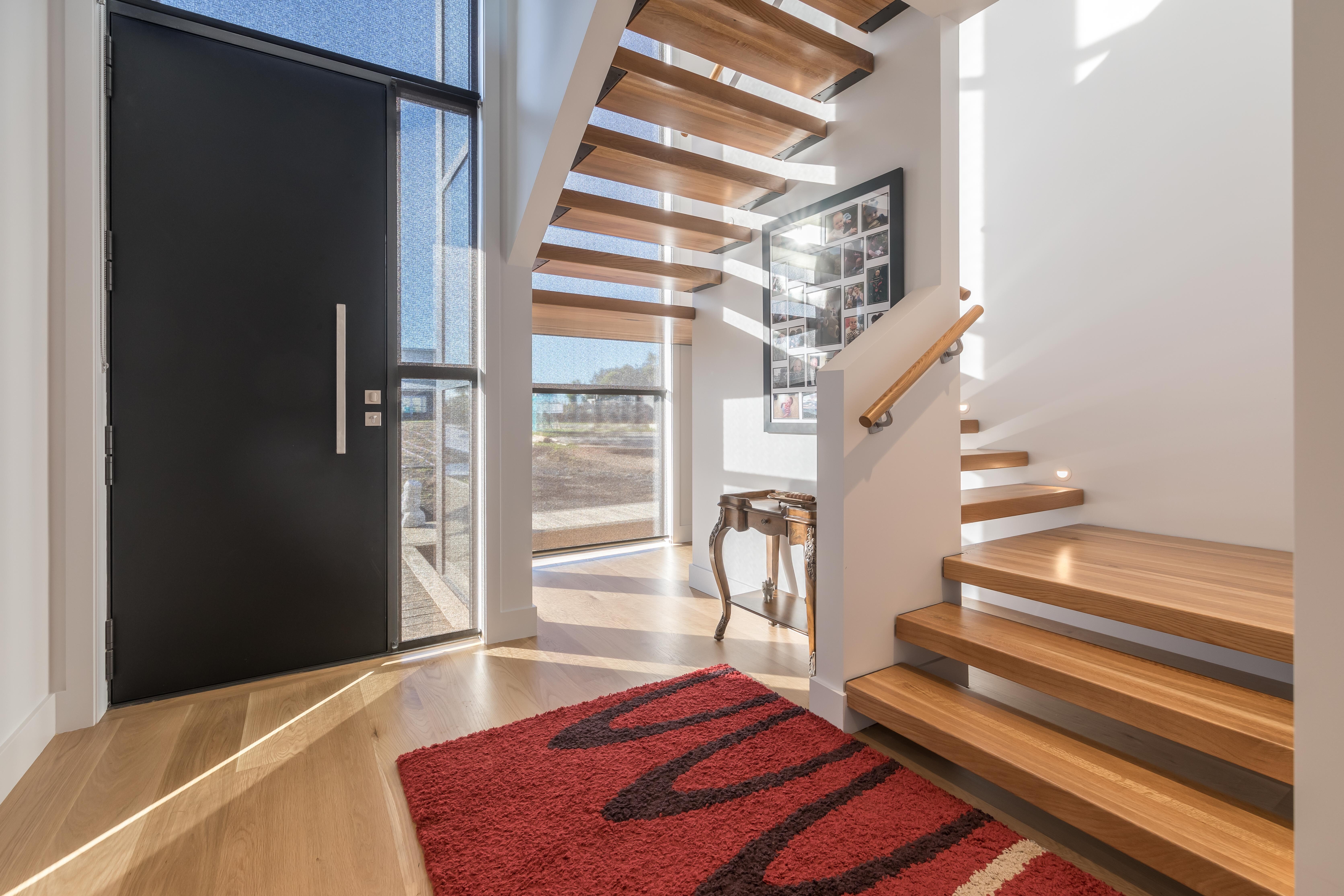 USA Oak Stair Treads & Handrail, Main Feature  in this modern entrance.
